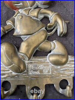 Rare Vintage Mickey Mouse solid brass key Towel holder from the 60's. Disney